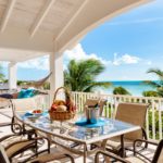 crystal-sands-luxury- beachfront-villa-turks-caicos-real-estate-balcony dining view