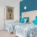 crystal-sands-luxury- beachfront-villa-turks-caicos-real-estate-bedroom twin beds