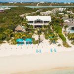 crystal-sands-luxury- beachfront-villa-turks-caicos-real-estate-drone view of front from beach