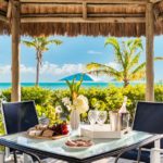 crystal-sands-luxury- beachfront-villa-turks-caicos-real-estate-outdoor lower level dining