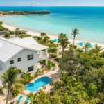 crystal-sands-luxury- beachfront-villa-turks-caicos-real-estate-back drone view of property