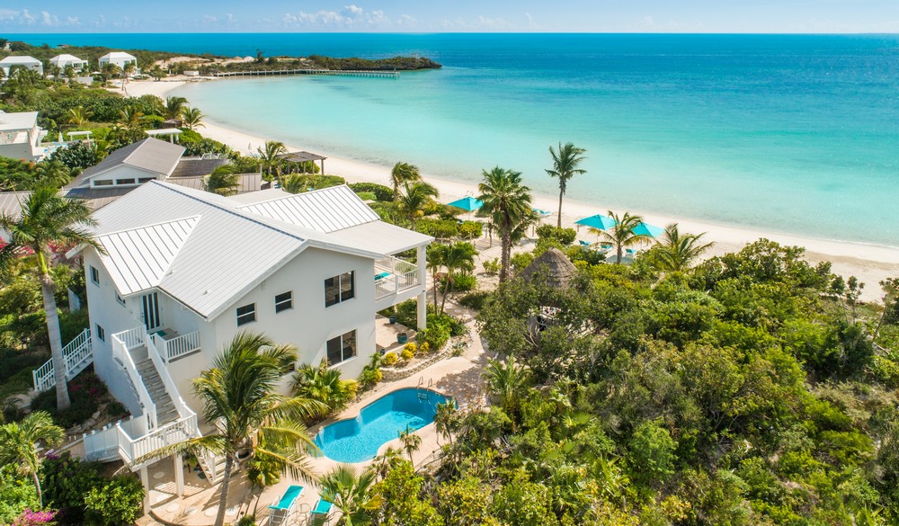 crystal-sands-luxury- beachfront-villa-turks-caicos-real-estate-back drone view of property