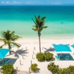 crystal-sands-luxury- beachfront-villa-turks-caicos-real-estate-lounge chairs on beach