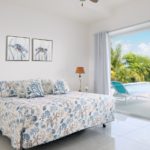 beachfront-sunrise-villa-turks-caicos-lower level bedroom pool view