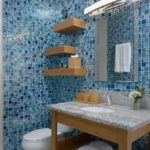 beachfront-sunrise-villa-turks-caicos-lower level bathrrom blue tiles wood floating shelves