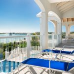 beachfront-sunrise-villa-turks-caicos-upper level balcony lounge chairs