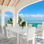 beachfront-sunrise-villa-turks-caicos-upper level balcony dining