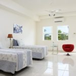 beachfront-sunrise-villa-turks-caicos-lower level bedroom twin beds