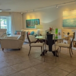 grace-bay-beach-condo-ocean-club-west-suite-513-dining and living area