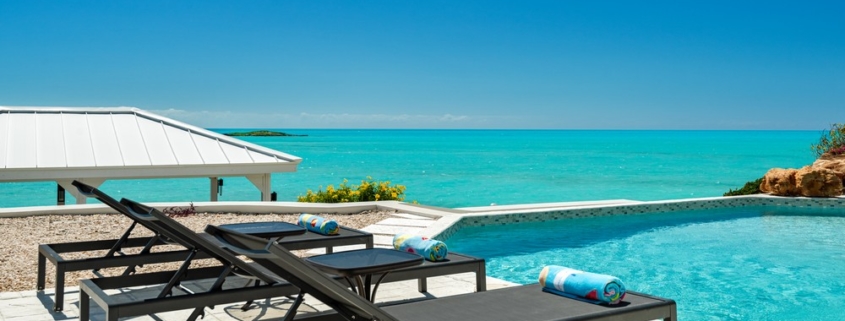 three-cays-villa-turtle tail bristol hill pool view to ocean and lounge chairs