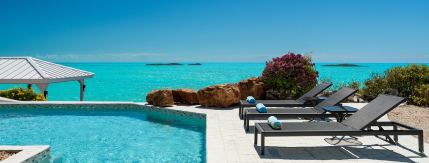 three-cays-villa-turtle tail bristol hill pool view to ocean and lounge chairs