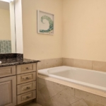 pinnacle-suite-303-3-bed-grace-bay-beachfront-condo second bedroom bathroom view