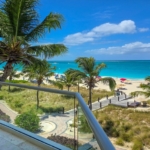 pinnacle-suite-303-3-bed-grace-bay-beachfront-condo balcony north shore view