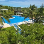 pinnacle-suite-303-3-bed-grace-bay-beachfront-condo pool and landscaping view