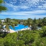 pinnacle-suite-303-3-bed-grace-bay-beachfront-condo pool and landscaping view