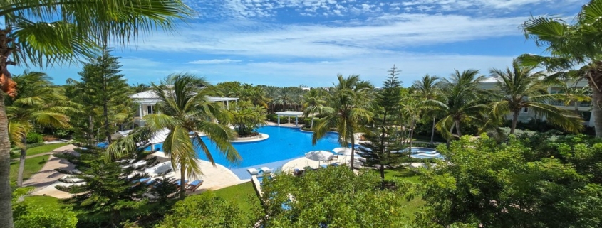 pinnacle-suite-303-3-bed-grace-bay-beachfront-condo pool and landscaping view