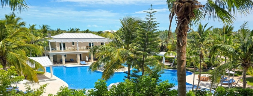 pinnacle-suite-303-3-bed-grace-bay-beachfront-condo pool and landscaping view