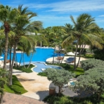 pinnacle-suite-303-3-bed-grace-bay-beachfront-condo pool and landscaping view