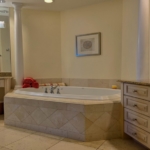 pinnacle-suite-303-3-bed-grace-bay-beachfront-condo primary bedroom bathroom view