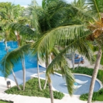 pinnacle-suite-303-3-bed-grace-bay-beachfront-condo pool and landscaping view