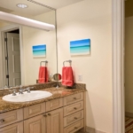 pinnacle-suite-303-3-bed-grace-bay-beachfront-condo primary bedroom bathroom view