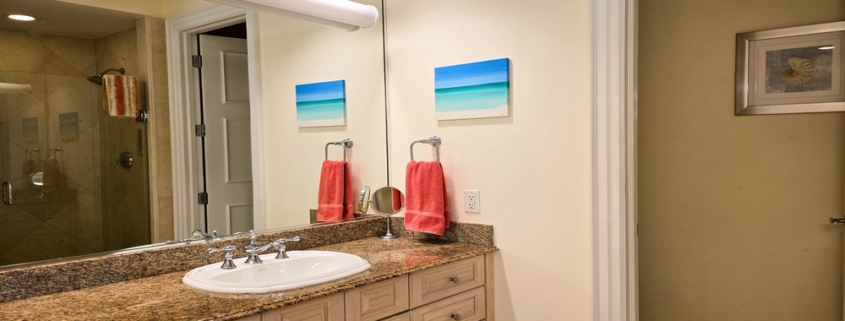 pinnacle-suite-303-3-bed-grace-bay-beachfront-condo primary bedroom bathroom view