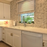 ocean-club-west-suite-511-one-bedroom-kitchen view mosaic marble backsplash