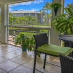 ocean-club-west-suite-511-one-bedroom-view of balcony and resort landscaping