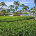 ocean-club-west-suite-511-one-bedroom-view of resort grounds to pool