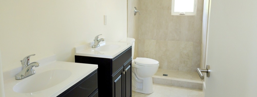 turks-caicos-house-for-sale-leeward-interior bathroom with vanities toilet and shower