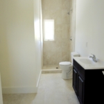 turks-caicos-house-for-sale-leeward-interior second bathroom with vanity toilet and shower