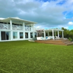 waterfront-turks-caicos-homes-for-sale-palm-point exterior of home lawn