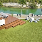 waterfront-turks-caicos-homes-for-sale-palm-point-upper level apartment view of gardens, deck and canal
