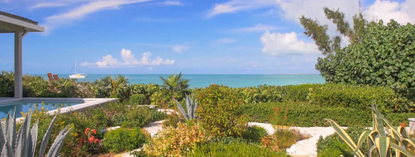 providenciales-oceanfront-home-chalk-sound exterior view of gardens to ocean