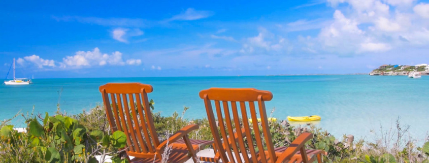 providenciales-oceanfront-home-chalk-sound seating area by the ocean