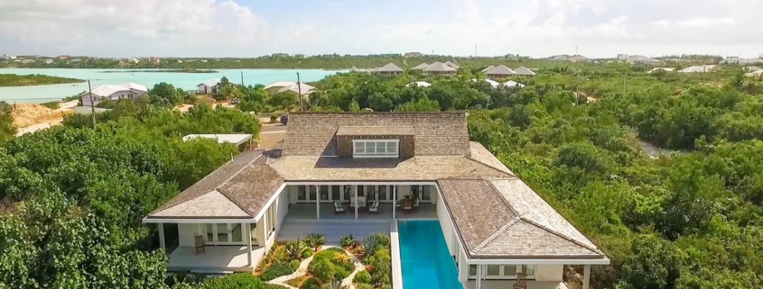 providenciales-oceanfront-home-chalk-sound drone view of backyard and pool