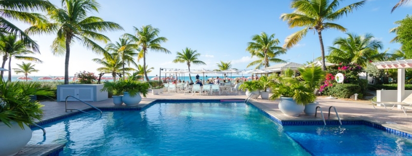 ocean-club-resort-grace-bay-beach-2-bedroom-condo front oceanview pool next to cabana bar