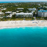 pinnacle-luxury-grace-bay-beachfront-drone view showing beach and area