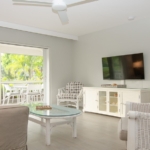 ocean-club-beach-level-grace-bay-condo-suite-5102 view of living area to balcony