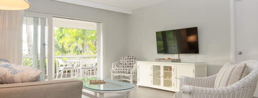 ocean-club-beach-level-grace-bay-condo-suite-5102 view of living area to balcony