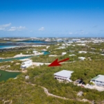 turks-caicos-canal-front-discovery-bay-drone view with arrow
