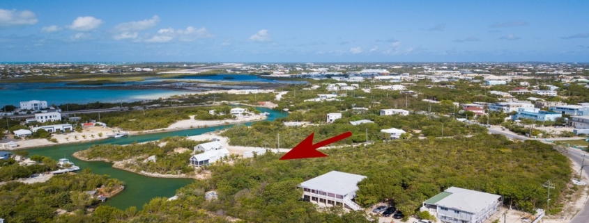 turks-caicos-canal-front-discovery-bay-drone view with arrow