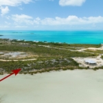 turks-caicos-waterfront-turtle-tail-home-site drone view with arrow showing location
