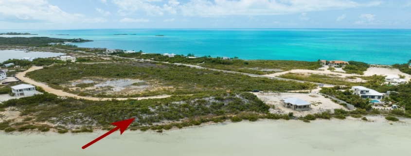 turks-caicos-waterfront-turtle-tail-home-site drone view with arrow showing location