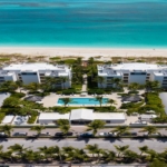 Le-Vele-suite-301-grace-bay-beachfront-condominium-drone view of resort and beach