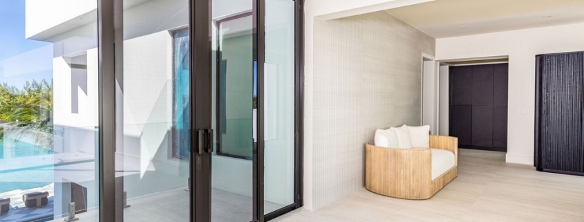 casa-verde-luxury-turks-caicos-canal-estate-lower level seating and access to patio