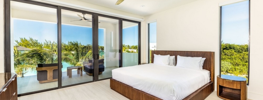 casa-verde-luxury-turks-caicos-canal-estate-lower level bedroom with pool view