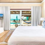 providenciales-oceanfront-villa-la-percha-chalk-sound-bedroom one view to pool