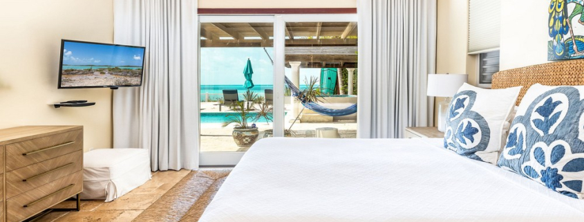 providenciales-oceanfront-villa-la-percha-chalk-sound-bedroom one view to pool