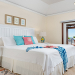 providenciales-oceanfront-villa-la-percha-chalk-sound-bedroom four view to pool